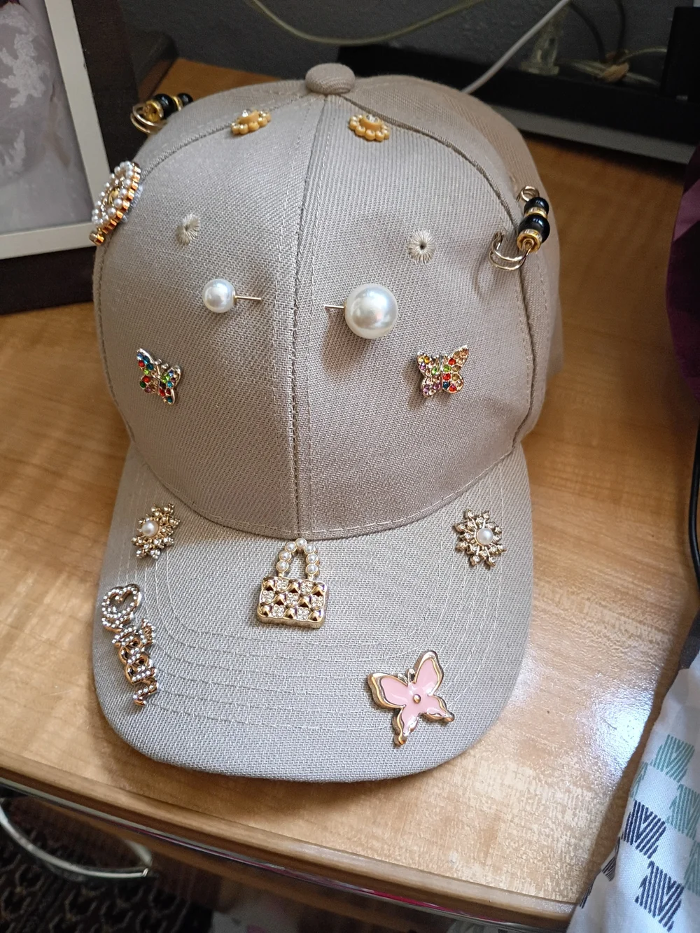 Embellished Beige Baseball Cap with Pearl & Charm Accents
